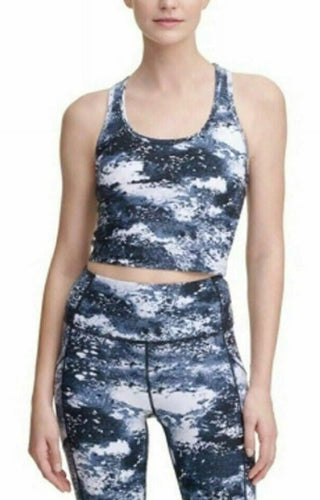 Person wearing a blue and white patterned athletic outfit on a white background