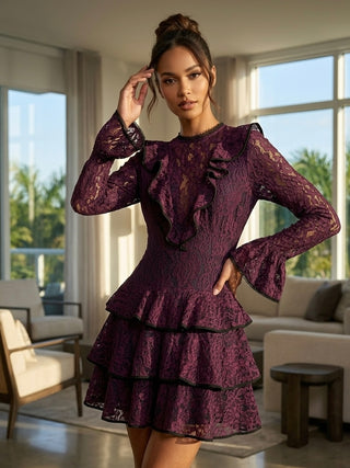 Woman wearing a purple lace dress in a modern living room.