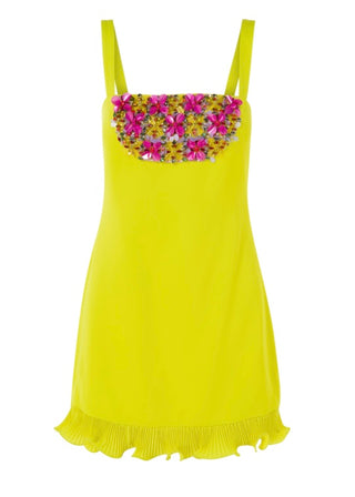 Yellow dress with floral embellishments on a white background