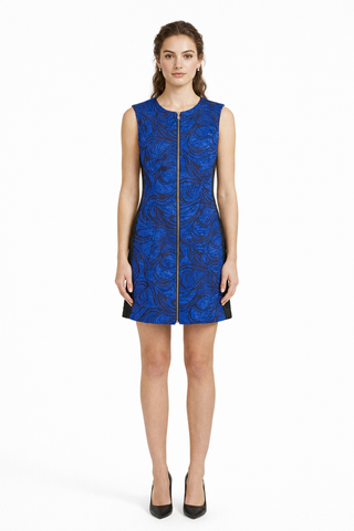 Woman wearing a blue lace dress on a white background