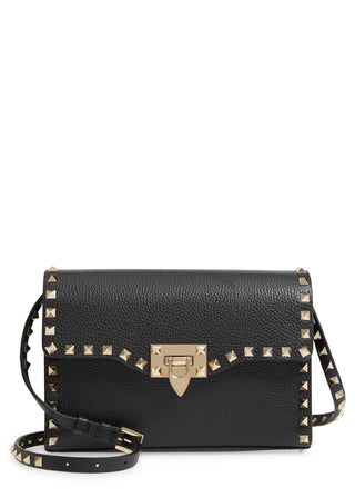 A black pebbled leather shoulder bag with gold-tone studs and a central clasp, shown on a plain white background.