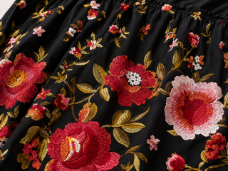 Black fabric with colorful floral embroidery
