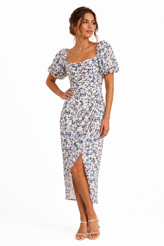 Woman wearing a floral dress on a white background