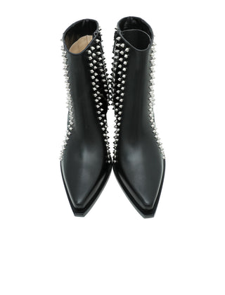 A pair of black leather pointed-toe ankle boots with silver metal studs running down the front, shown against a plain white background.