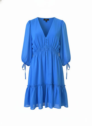 Blue dress with long sleeves on a white background