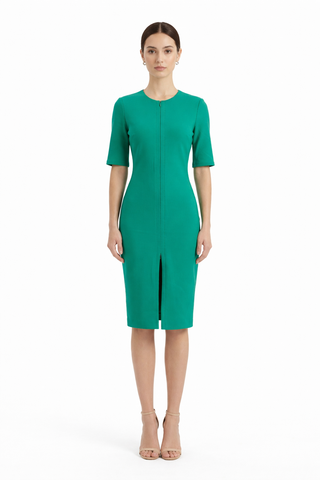 Woman wearing a green dress on a white background