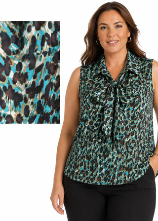 Woman wearing a sleeveless patterned blouse with close-up of fabric texture on a white background