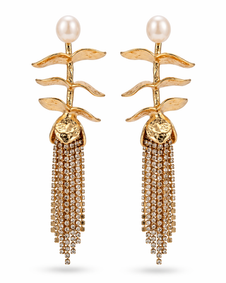 Gold earrings with pearl tops and tassel details on a white background