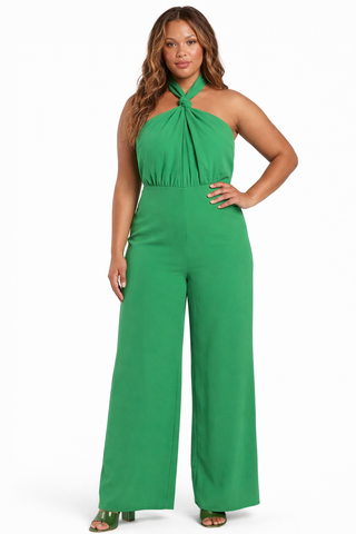 Woman wearing a green jumpsuit on a white background