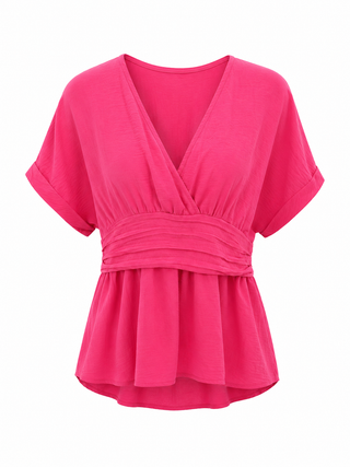 A bright pink short-sleeve wrap-style blouse with a V-neckline and gathered peplum hem, shown on a plain white background.