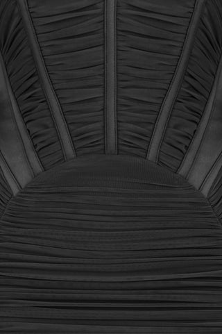 Close-up of a black pleated fabric texture