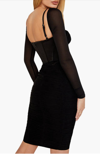 Black dress with sheer sleeves on a white background