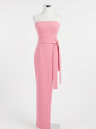 Pink strapless gown on a mannequin against a white background