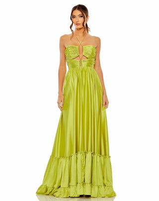 Woman wearing a bright green evening gown on a white background