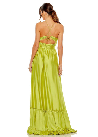 Woman wearing a green evening gown with a white background