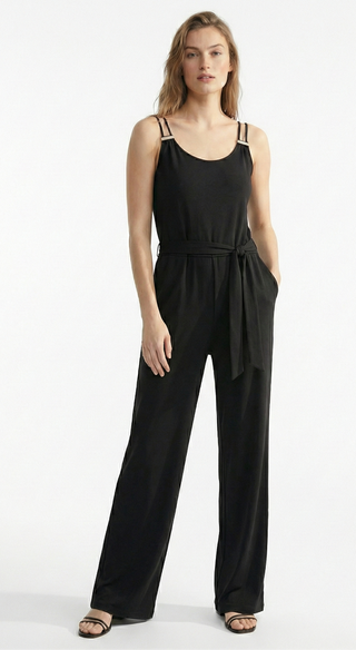 Woman wearing a black jumpsuit on a white background