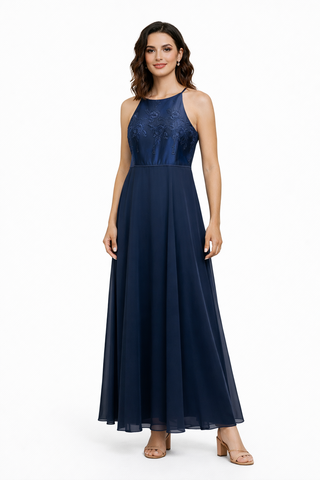 Woman wearing a navy blue evening gown on a white background