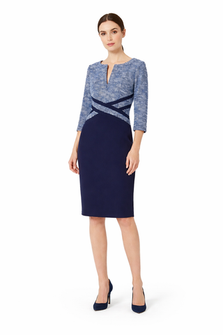 Woman wearing a blue and navy dress on a white background