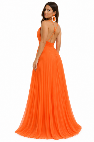 A woman modeling a bright orange sleeveless maxi dress from the back, featuring a deep V-neckline, thin shoulder straps, a low open back, and a flowing pleated skirt, set against a plain white background.