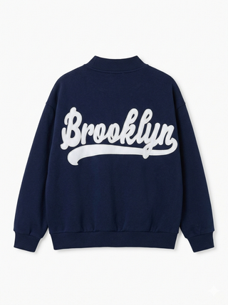 Navy blue sweatshirt with 'Brooklyn' text on a white background