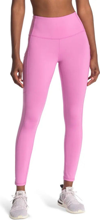 Pink leggings worn by a person, with a focus on the garment.