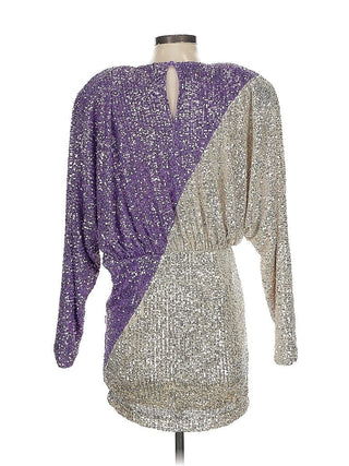 Two-tone purple and silver sequin dress on a mannequin against a white background