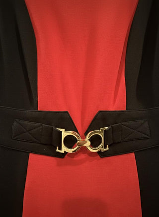 Black belt with a gold buckle on a red and black garment