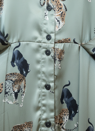 Close-up of a jacket with panther pattern on a light green background