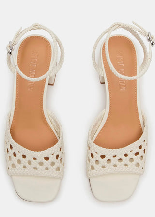 A pair of Steve Madden women's heeled sandals in off-white, featuring woven lace-up straps and a square toe with a cutout pattern on the upper.
