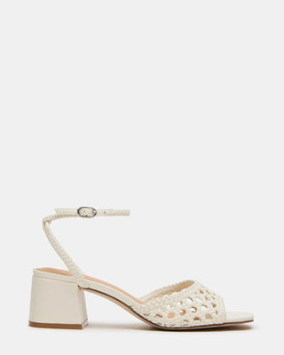 White sandal with woven design on a white background