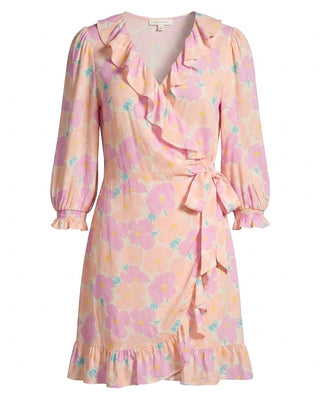 Pastel floral dress with ruffled details on a white background